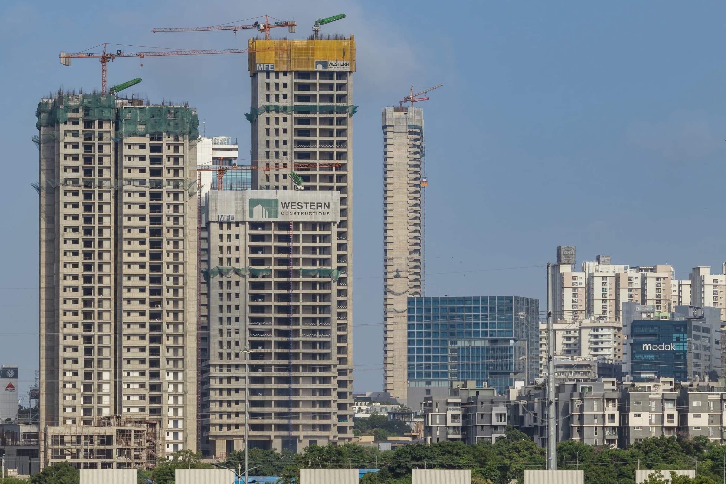 Tower cranes above high-rise buildings under construction